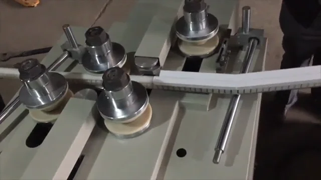 Tube bending machine for reverse bends including aluminium extrusions